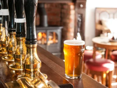 Pints of beer on a bar counter