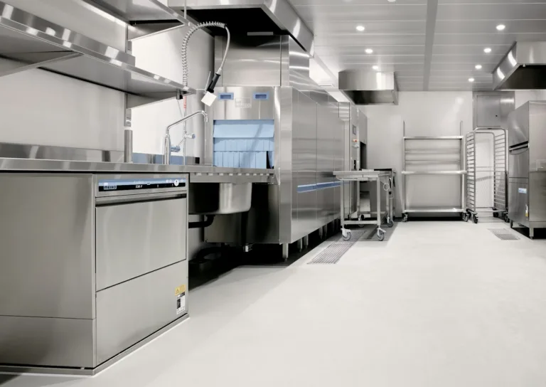 Stainless steel commercial kitchen fitted with dishwashing and warewashing equipment